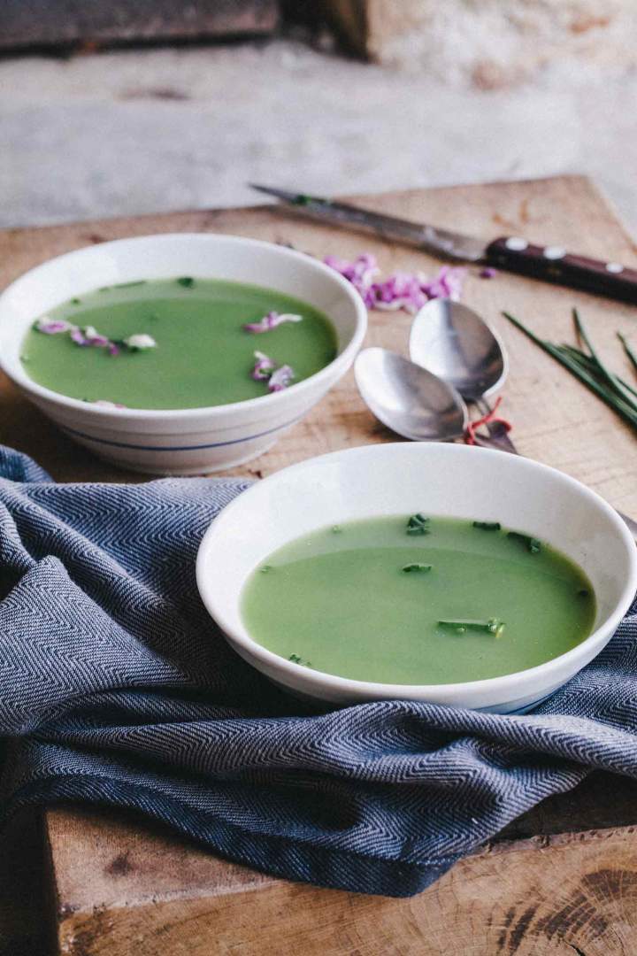 nettle soup with chives served in bowls