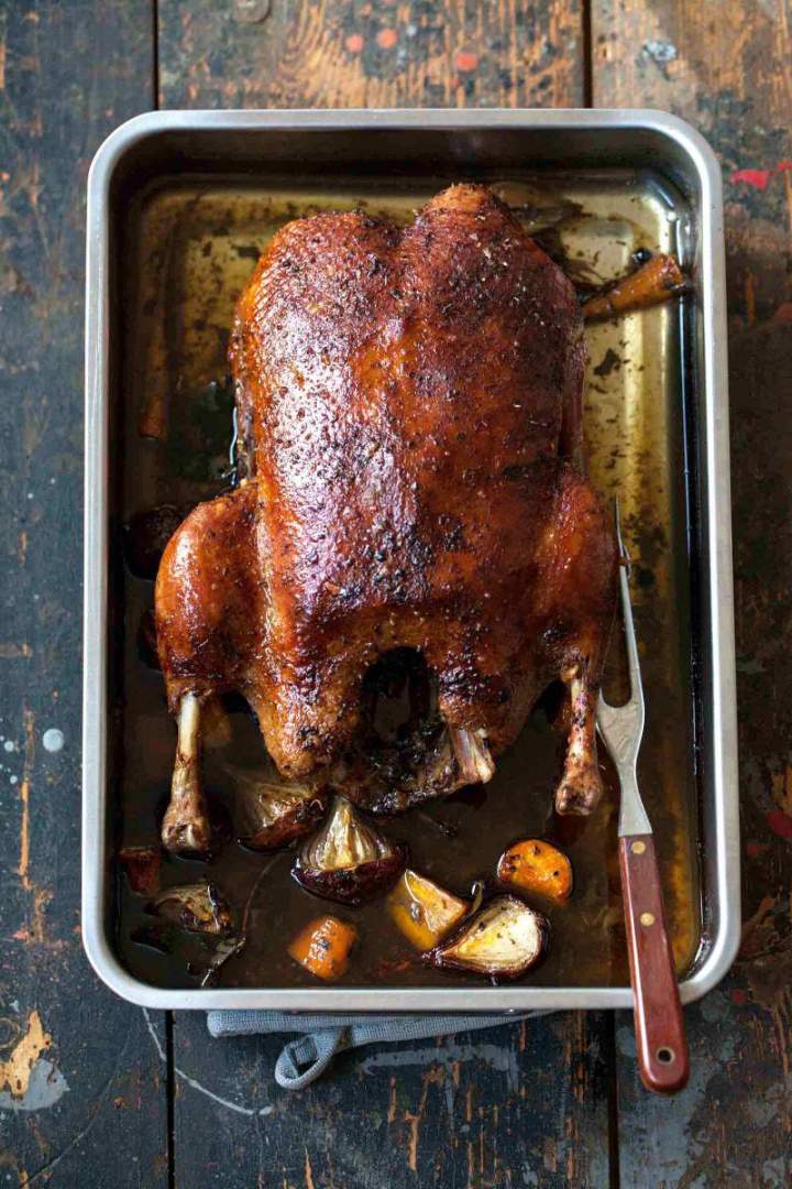 Whole Roast duck in a baking dish