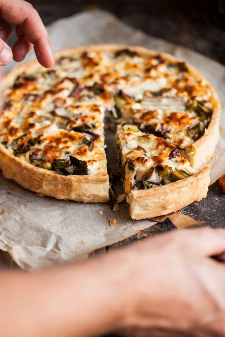Slice of Soft cheese and vegetables tart
