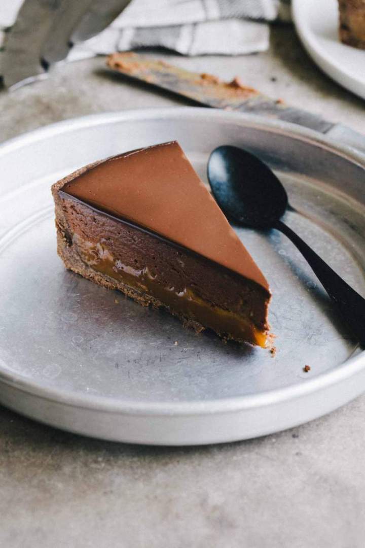 Slice of Buckwheat pie with chestnuts, caramel and chocolate