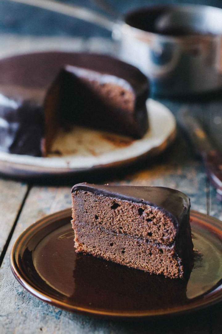 Sacher torte cut on slices with layers of chocolate and marmalade